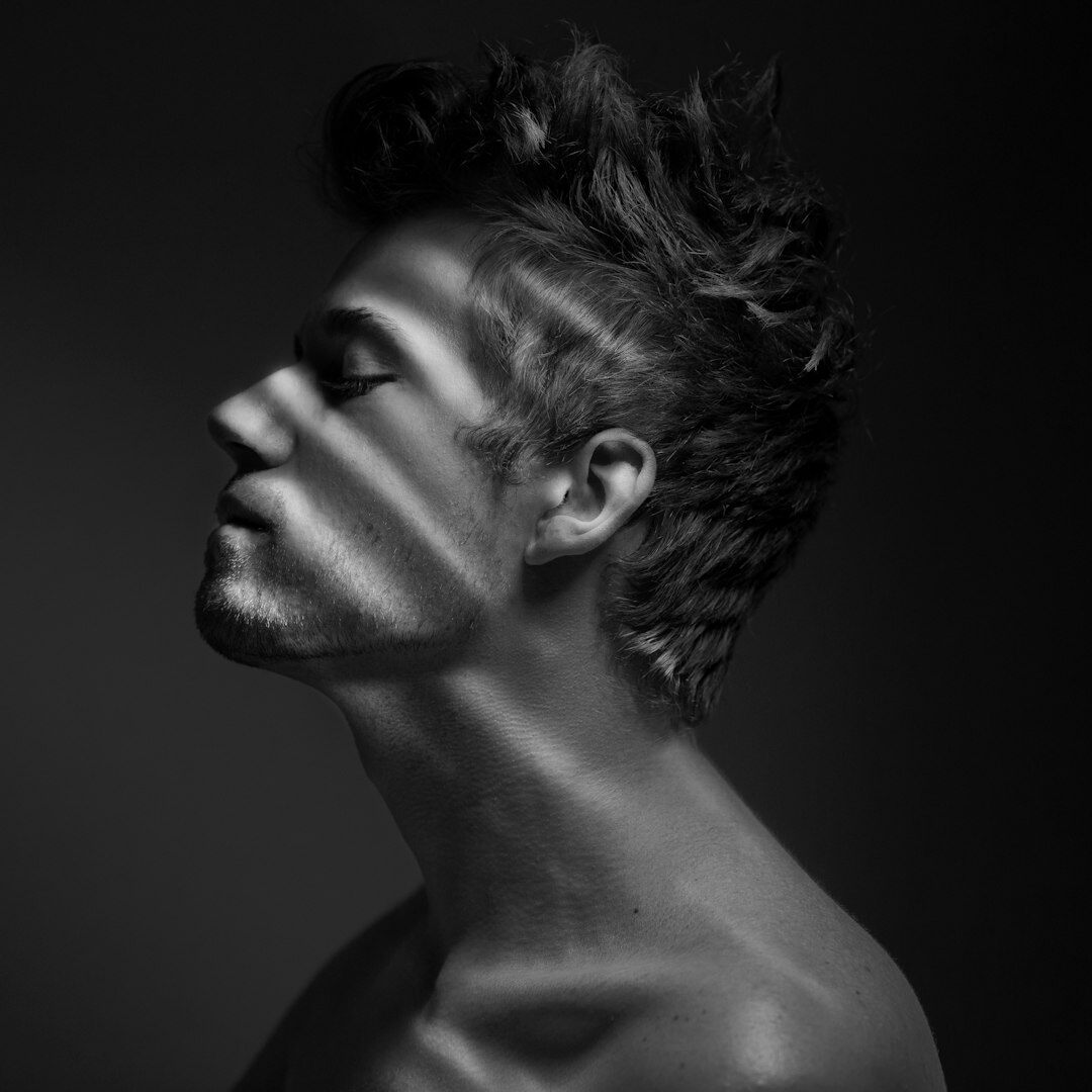 Studio portrait of a young man with short hair