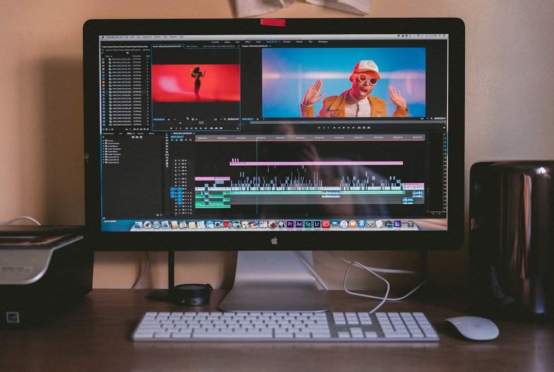 person editing audio on computer