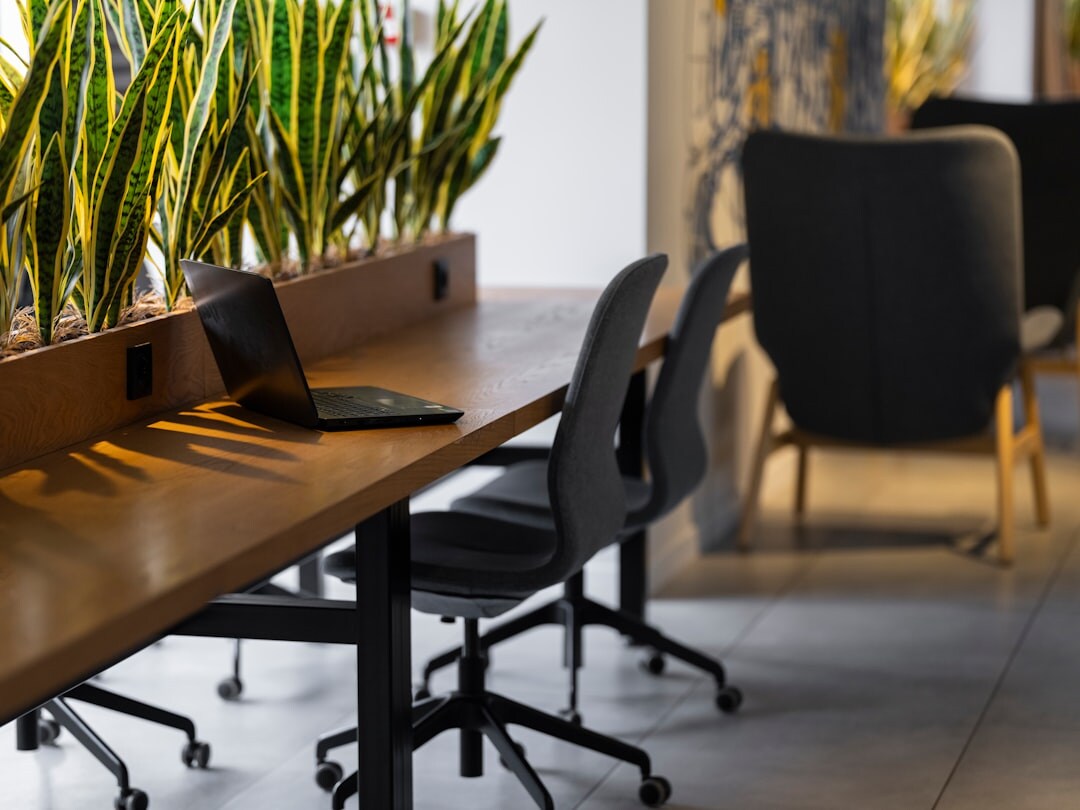 Modern bright office interior with desks and plants