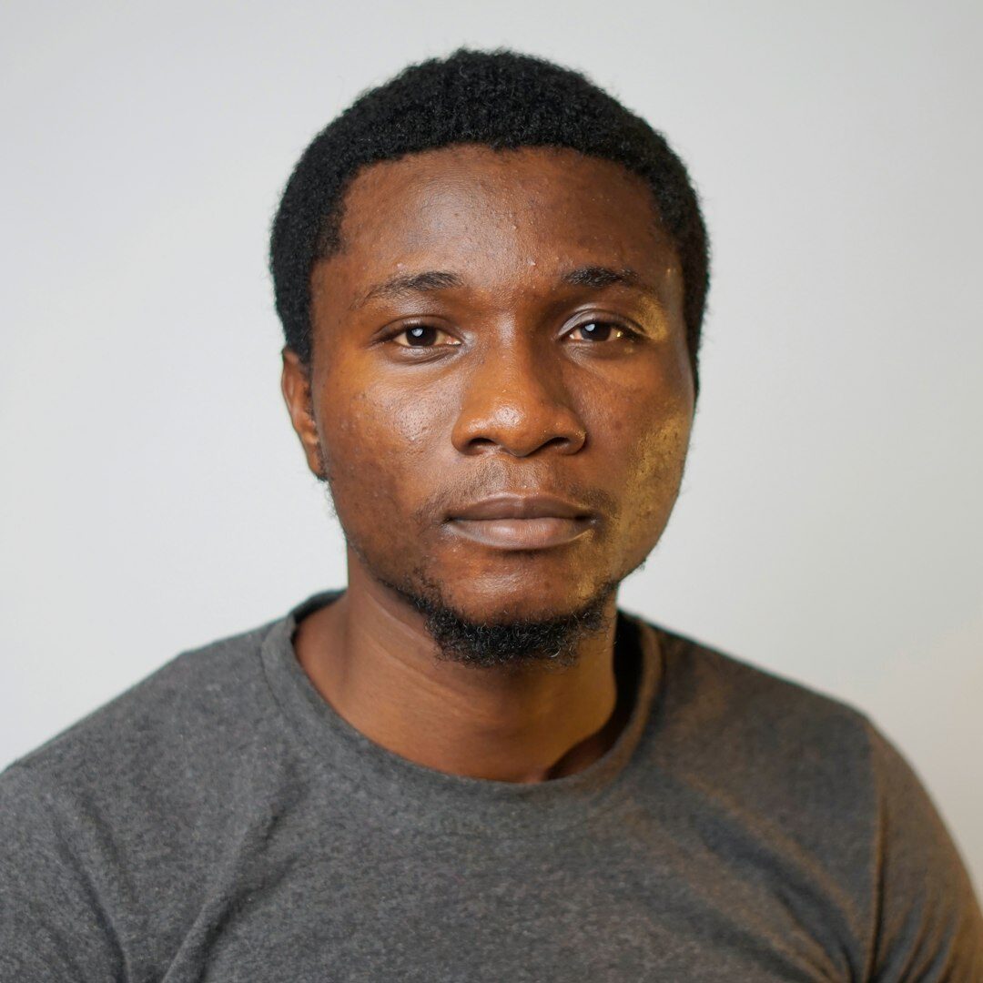 Studio portrait of a smiling young man