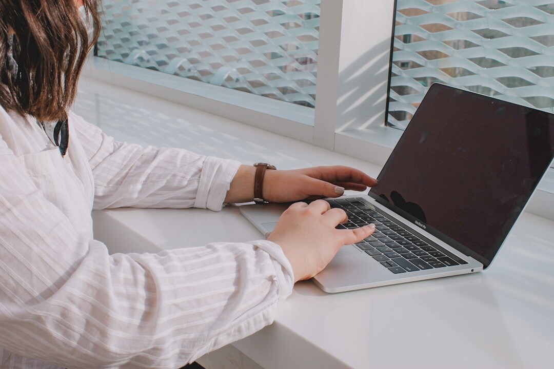 blogger writing on laptop