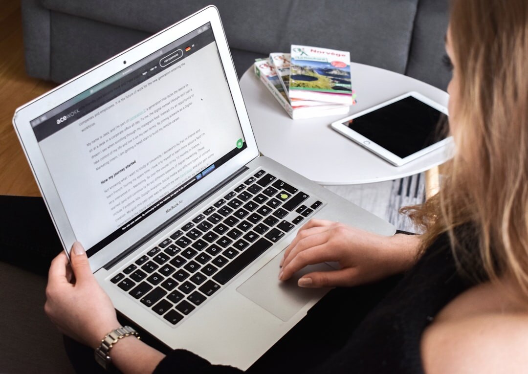 blogger writing on laptop
