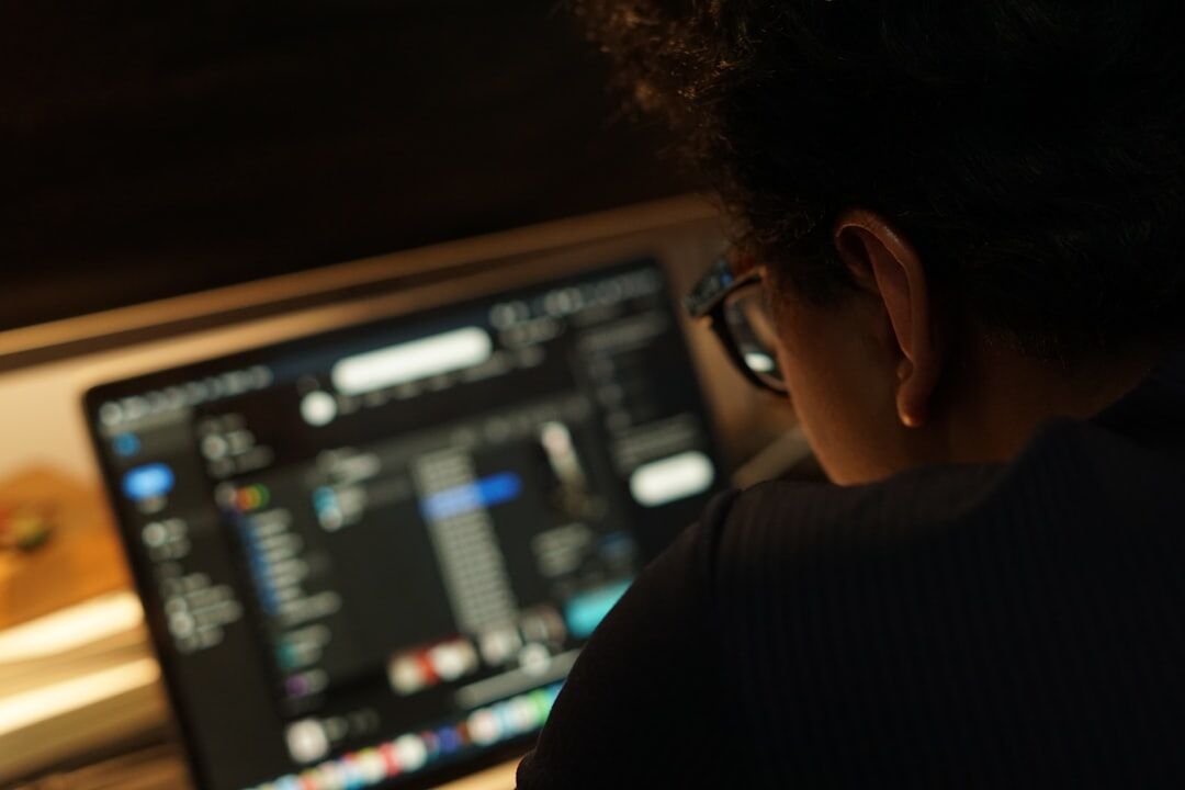 woman editing audio on computer